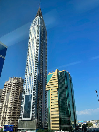 Tall modern skyscrapers under blue sky in Dubai business district, Dubai 18.01.2025 United Arab Emirates.のeditorial素材