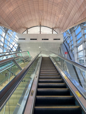 Upward view of escalator in modern metro station with architectural ceiling, Dubai 18.01.2025 United Arab Emirates.のeditorial素材