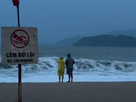 Close view of No Swimming sign near sea waves and stormy horizon in Nha Trang, 06.11.2025, Vietnam.のeditorial素材