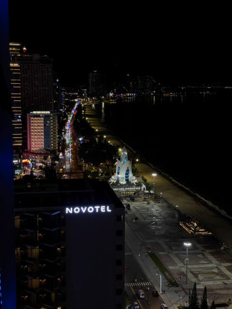 Night panorama of Nha Trang beach with Novotel hotel and city lights. Nha Trang, October 10, 2025, Vietnam.のeditorial素材