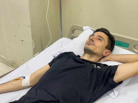 Patient resting after IV infusion in hospital ward, Nha Trang, October 18, 2025, Vietnamのeditorial素材