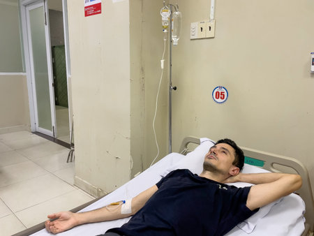 Patient resting with IV drip in hospital bed, Nha Trang, October 18, 2025, Vietnamのeditorial素材