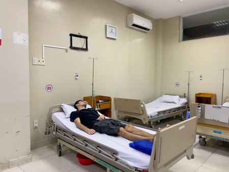 Patient resting on hospital bed in clean medical room, Nha Trang 18.10.2025 Vietnamのeditorial素材