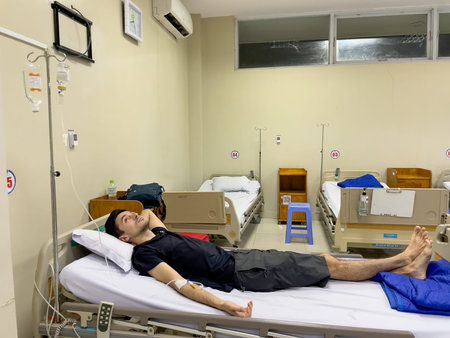 Patient receiving IV infusion in clean hospital ward, Nha Trang, October 18, 2025, Vietnamのeditorial素材