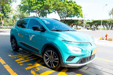 Modern Teal Electric Taxi VinFast VFe34 Parked on Urban Street in Da Nang Vietnam Sustainable...
