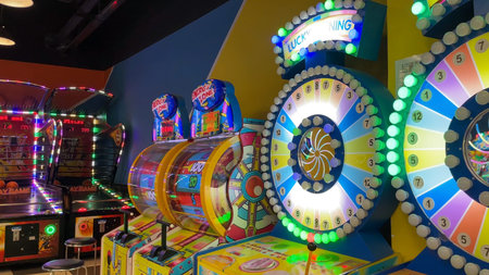 Bright Arcade Game Room with Colorful Spinning Wheels and Neon Lights Nha Trang Shopping Center Nha...