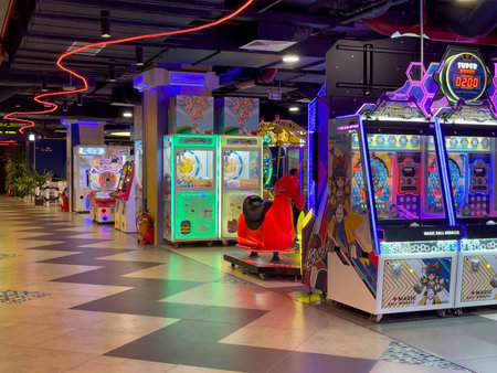 Vibrant Indoor Arcade Hall with Neon Lighting and Colorful Gaming Machines Gold Coast Mall Nha Trang...