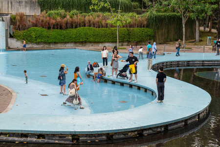 People Enjoying the Wading Pool at KLCC Park in Kuala Lumpur 29.01.2026 Malaysiaのeditorial素材