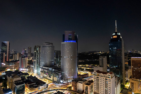 Kuala Lumpur City Center Night Skyline with Illuminated Skyscrapers and JKG Tower in Kuala Lumpur...