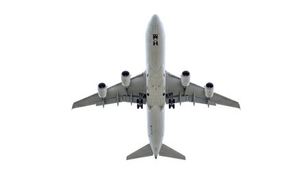 This image shows a top view of a large commercial airliner with four engines, captured during flight against a clear sky.の素材