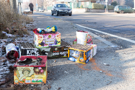 TURIN, ITALY - JANUARY 1, 2016: Remnants of fireworks at a waste collection after the traditional...