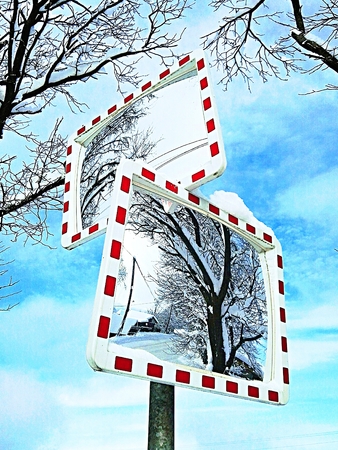 Traffic mirror reflection on the roadのeditorial素材