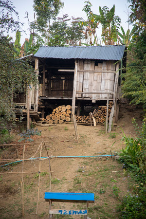 Wooden shed with firewood in a rural village in Myanmarの写真素材