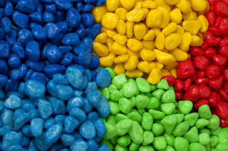 Candy sea pebbles with colorful backgroundの写真素材