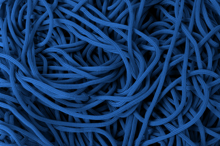 detail of blue rope resting in coilの写真素材