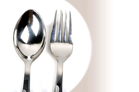 closeup shot on spoon and fork with white background