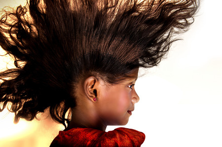 baby hair floating through the air with white backgroundの写真素材