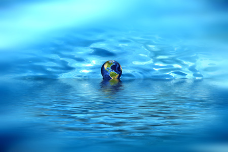 3d design of a globe on the waterの写真素材