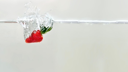 strawberry dipped in waterの写真素材