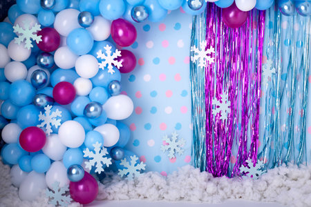 Festive background with colorful balloons, snowflakes and gift box