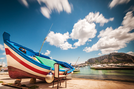 A small fishing boat in a port in Sicily (Italy)の写真素材