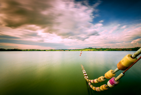 View from the pier on the lake of Chiusi in Tuscany (Italy)の写真素材