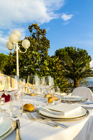 The table is set and ready for guests at a business dinner, a wedding or a party.の写真素材
