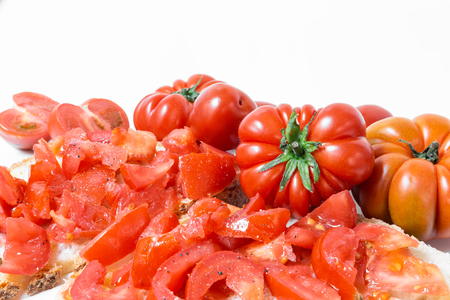 Bread oil and tomato. Appetizing very fresh food typical of the Mediterranean diet, seasoned with the addition of salt and pepper.
の写真素材