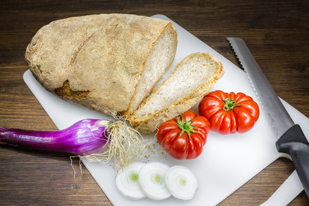 A classic and healthy combination, bread, tomato and onion have a fundamental part in the Mediterranean diet.の写真素材