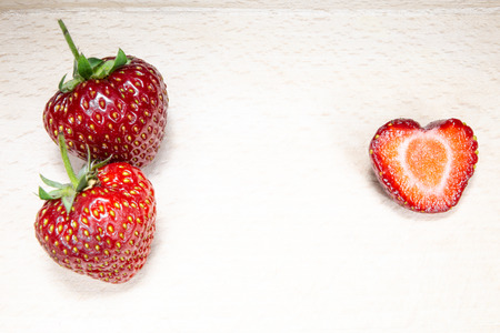 Strawberry in the shape of a heartの写真素材
