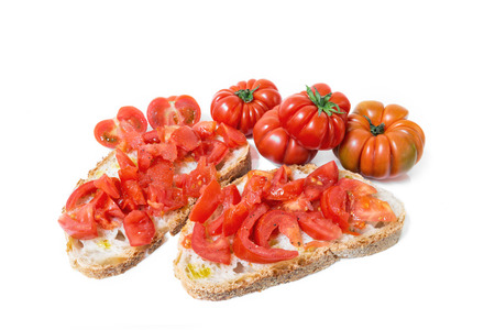 Bread oil and tomato. Appetizing very fresh food of the Mediterranean, seasoned with salt and pepper.の写真素材