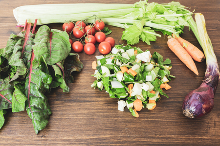 A mix of fresh vegetables on an old tableの写真素材