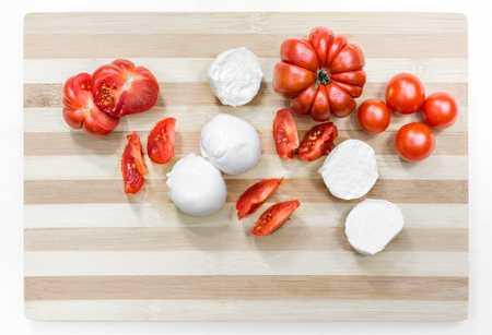 Buffalo mozzarella and tomatoes, a typical combination known as Caprese, which is part of the Mediterranean diet.の写真素材