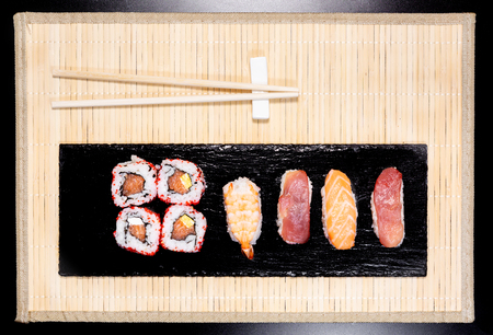 Sushi, a typical Japanese food prepared with a base of rice and various raw fish such as tuna, salmon, shrimp and sea bream. To which is added, according to the variants. It can be accompanied by soy sauce.の写真素材