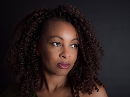 horizontal portrait of an  attractive African American woman daydreamingの写真素材