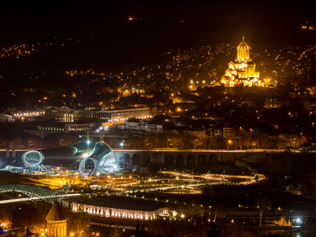 Tbilisi seen from Fort Narikala with the The Holy Trinity Cathedral by night 
