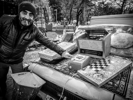 Georgian man sells old used items on the Dry Bridge Market in Tbilisi, Georgia のeditorial素材