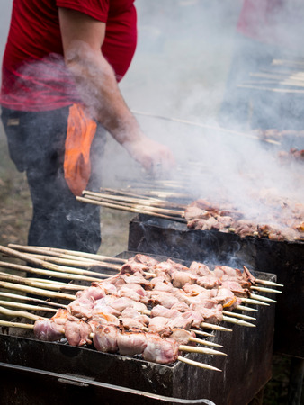 People prepare traditional mtsvadi during Young Wine Festival in Tbilisi, May 2013のeditorial素材