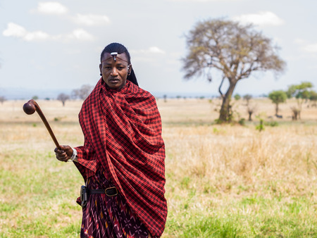Maasai warrior in Mikumi, Tanzania. The Maasai are a Nilotic ethnic group of semi-nomadic people inhabiting southern Kenya and northern Tanzania.のeditorial素材