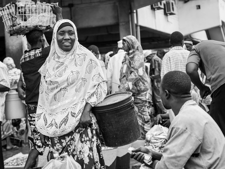 ocal people in the fish market in Dar es Salaam in East Africa on Sunday. Black and white.のeditorial素材
