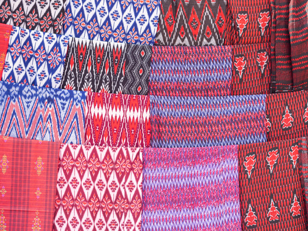 Maasai materials and fabrics with traditional patterns and designs sold on a local market.の写真素材
