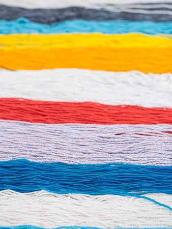 Beads for making Maasai necklaces sold on a local Maasai market in Tanzania.の写真素材