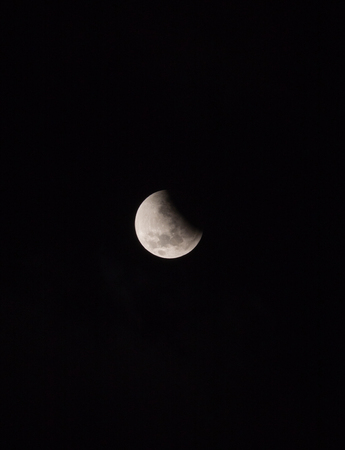Total eclipse of the moon on 28th September 2015 on it's early stages seen from Dar es Salaam, Tanzania, Africa.の写真素材