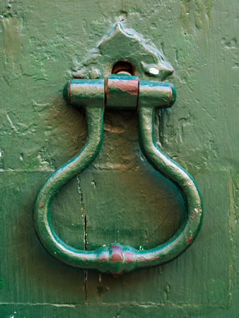 Old metal knocker in Barrio Alto, Lisbon, Portugal. Close up.の写真素材