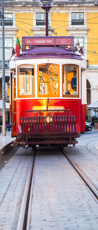 Old tram on the Praca do Comercio (Commerce Square) in Lisbon, Portugal.のeditorial素材