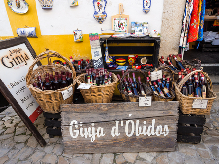 OBIDOS, PORTUGAL Ã¢ï¿½ï¿½ APRIL 03, 2017: Gift store selling Ginja de Obidos, traditional regional cherry liquor.のeditorial素材