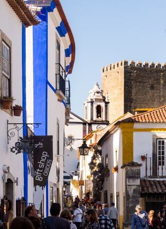 OBIDOS, PORTUGAL - APRIL 03, 2017: People walking on the main street of Obidos on April 03, 2017.のeditorial素材