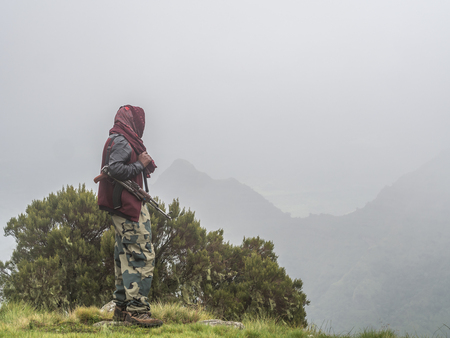 A man carring a kalashnikov in Semien mountains, Ehtiopia.