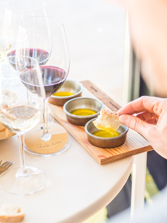 Young man tasting olive oils during wine and olive oil tasting in Alentejo region, Portugal.の素材 [FY31098437417]