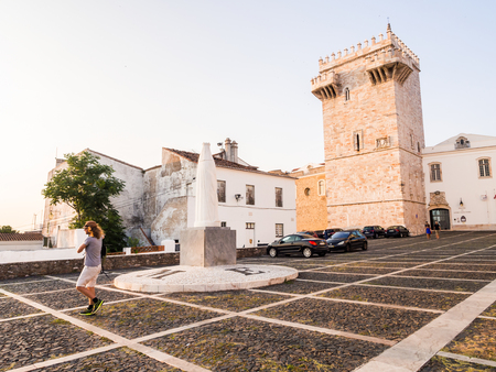 ESTREMOZ, PORTUGAL â AUGUST 23, 2018: Estremoz Castle (Castelo da Rainha Santa Isabel) with Tres Coroas (Three Crowns) marble tower and Santa Isabel monument, at sunset.のeditorial素材